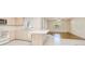 Open kitchen with an island and views of the living room at 23482 Moreland Ave, Port Charlotte, FL 33954