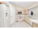 Efficient kitchen with white appliances and tiled floors at 23482 Moreland Ave, Port Charlotte, FL 33954