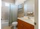 Bright bathroom with a shower-tub combo and tiled floor at 2363 Jasmine Way, North Port, FL 34287