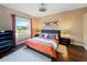 Comfortable bedroom featuring a large window and a modern decor at 2363 Jasmine Way, North Port, FL 34287
