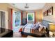 Well-lit bedroom with a view of the pool at 2363 Jasmine Way, North Port, FL 34287