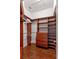 Spacious closet featuring built-in shelving and drawers, providing ample storage solutions at 2363 Jasmine Way, North Port, FL 34287