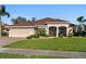 Charming single-Gathering home featuring a two-car garage at 2363 Jasmine Way, North Port, FL 34287