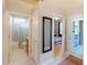 Hallway featuring doorways to a bathroom and bedroom at 2363 Jasmine Way, North Port, FL 34287