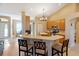 Open concept kitchen with breakfast bar, stainless appliances, and lots of natural light at 2363 Jasmine Way, North Port, FL 34287