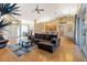 Spacious open-concept living area with hardwood floors, high ceilings and lots of natural light at 2363 Jasmine Way, North Port, FL 34287