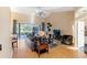 Bright living room with vaulted ceiling, hardwood floors, large windows and a view of the backyard at 2363 Jasmine Way, North Port, FL 34287