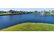 Tranquil pond with a fountain and lush green surroundings at 2363 Jasmine Way, North Port, FL 34287