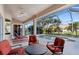 Relaxing screened-in pool area with comfortable patio furniture, ideal for enjoying the outdoors at 2363 Jasmine Way, North Port, FL 34287