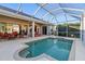 Inviting backyard pool and patio area, furnished with outdoor seating, perfect for entertainment at 2363 Jasmine Way, North Port, FL 34287