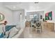 Bright dining area featuring elegant furnishings, neutral decor, and ample natural light at 24909 Drumblaire Ct, Port Charlotte, FL 33980
