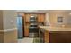 Contemporary kitchen with stainless steel appliances, a stylish backsplash, and a functional design at 25275 Rampart Blvd # 206, Punta Gorda, FL 33983