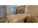 Functional kitchen featuring modern appliances, a breakfast bar, and a convenient layout at 25275 Rampart Blvd # 206, Punta Gorda, FL 33983