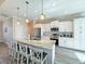 Spacious kitchen with a large center island, stainless steel appliances, and pendant lighting at 25428 Islas Dr, Punta Gorda, FL 33955
