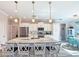 Open kitchen featuring a center island with a sink, counter seating, and updated appliances at 25428 Islas Dr, Punta Gorda, FL 33955