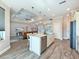 Kitchen island featuring an undermount sink and open layout with a view to the living area at 25428 Islas Dr, Punta Gorda, FL 33955