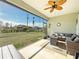 Screened in patio with outdoor furniture, ceiling fan, and view of backyard at 25428 Islas Dr, Punta Gorda, FL 33955