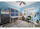 Bedroom featuring a murphy bed, desk, area rug, and a window with plantation shutters at 303 W Grace St, Punta Gorda, FL 33950