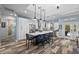 Modern kitchen with stainless steel appliances, granite counters, and a large island at 303 W Grace St, Punta Gorda, FL 33950