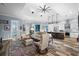 Open-concept living room with kitchen access and plenty of space for entertaining at 303 W Grace St, Punta Gorda, FL 33950