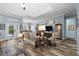 Cozy living room with wood floors, neutral-toned furniture, and ample natural light at 303 W Grace St, Punta Gorda, FL 33950