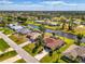 Florida neighborhood featuring lovely homes with canals, mature trees, and well-kept landscaping at 32 Long Meadow Ln, Rotonda West, FL 33947