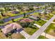 Waterfront homes in Florida neighborhood with lush landscaping and access to canals at 32 Long Meadow Ln, Rotonda West, FL 33947