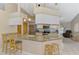 Bright kitchen with a granite countertop, an open layout, and modern appliances at 32 Long Meadow Ln, Rotonda West, FL 33947