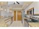 Updated kitchen featuring stainless steel appliances, granite counters, and modern white cabinetry at 32 Long Meadow Ln, Rotonda West, FL 33947