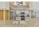Kitchen features granite countertops, stainless steel appliances, and modern white cabinetry at 32 Long Meadow Ln, Rotonda West, FL 33947