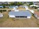 Aerial view of a well-maintained single-Gathering home and the neighborhood at 3249 Sunrise Trl, Port Charlotte, FL 33952