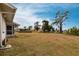 Large backyard with mature trees and a privacy fence at 3249 Sunrise Trl, Port Charlotte, FL 33952
