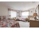 Bright bedroom with two twin beds, neutral color walls, and a plush rug at 3249 Sunrise Trl, Port Charlotte, FL 33952