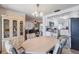 Bright dining area connecting the living room and kitchen, perfect for Gathering meals and entertaining at 3249 Sunrise Trl, Port Charlotte, FL 33952