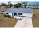 Charming single-story home featuring a new roof, attached garage, and well-maintained front yard at 3249 Sunrise Trl, Port Charlotte, FL 33952