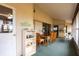 Enclosed porch with dining table, chairs and shelving unit at 3249 Sunrise Trl, Port Charlotte, FL 33952