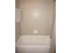 A tiled shower/bathtub with neutral wall tiles at 3311 Purple Martin Dr # 126, Punta Gorda, FL 33950