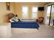 Bright bedroom featuring a queen-sized bed and a view of the outside at 3311 Purple Martin Dr # 126, Punta Gorda, FL 33950