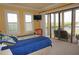Bright bedroom with a queen-sized bed and balcony access at 3311 Purple Martin Dr # 126, Punta Gorda, FL 33950