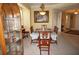 Well-lit dining room showcasing the table, chairs, china cabinet, and adjacent hallway at 3311 Purple Martin Dr # 126, Punta Gorda, FL 33950