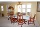 Elegant dining room with decorative chairs, chandelier, and large windows filling the space with natural light at 3311 Purple Martin Dr # 126, Punta Gorda, FL 33950