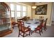 Bright dining area featuring a decorative china cabinet, table with seating, and stylish artwork at 3311 Purple Martin Dr # 126, Punta Gorda, FL 33950