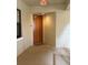 Condo entryway featuring a solid door and neutral tones, creating a private entrance to the unit at 3311 Purple Martin Dr # 126, Punta Gorda, FL 33950