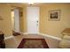 Inviting foyer featuring tile flooring and a stylish rug, offering a warm welcome into the home at 3311 Purple Martin Dr # 126, Punta Gorda, FL 33950