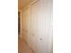 A hallway showcasing a set of classic white doors providing plenty of storage in this home at 3311 Purple Martin Dr # 126, Punta Gorda, FL 33950