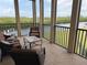 Inviting screened lanai offers comfortable seating and scenic waterfront views at 3311 Purple Martin Dr # 126, Punta Gorda, FL 33950