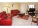 Comfortable living room with classic decor, plush seating and a bright and airy atmosphere at 3311 Purple Martin Dr # 126, Punta Gorda, FL 33950