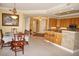 Open floor plan featuring a breakfast bar, dining area, and seamless flow to the living room at 3311 Purple Martin Dr # 126, Punta Gorda, FL 33950
