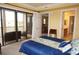 Bright main bedroom with a balcony and a bathroom featuring a walk-in shower and vanity at 3311 Purple Martin Dr # 126, Punta Gorda, FL 33950