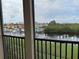This screened lanai overlooks a picturesque waterway with boats and colorful waterfront homes at 3311 Purple Martin Dr # 126, Punta Gorda, FL 33950